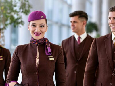 Smiling Etihad Airways Crew in terminal