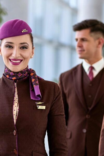 Smiling Etihad Airways Crew in terminal