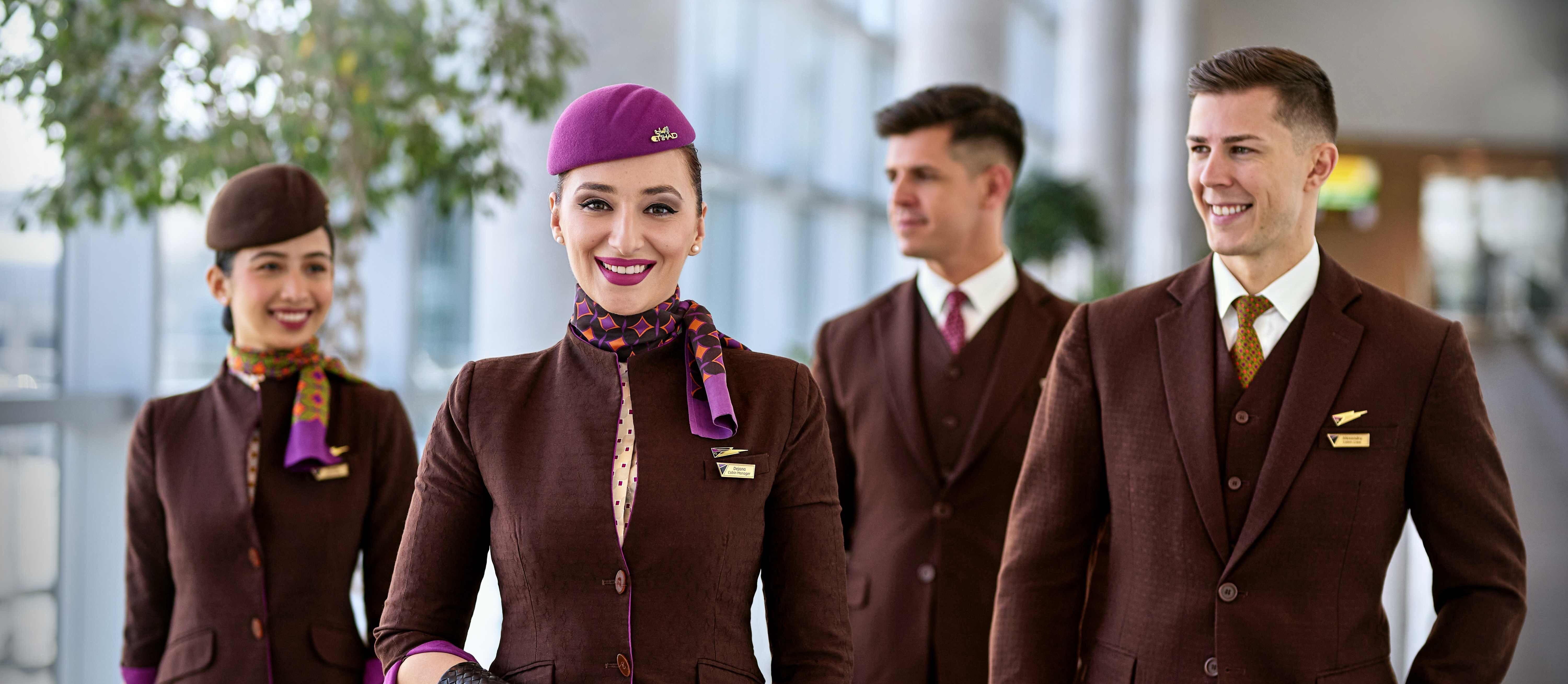 Smiling Etihad Airways Crew in terminal